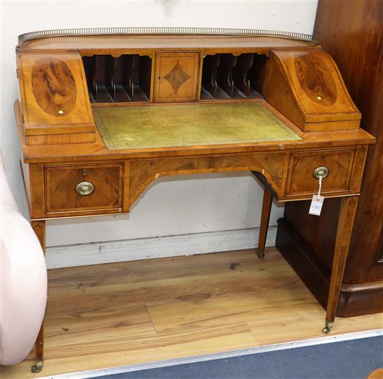 A George III style banded and inlaid mahogany Carlton House desk W.107cm